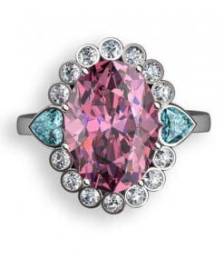 oval turmalin samt hjärtslipade blå topaser och diamanter i rosettring
